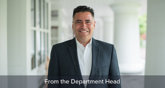 Luis F. Ayala outside smiling