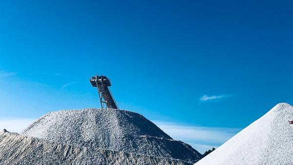 Limestone Stockpile mine with blue cloudless sky