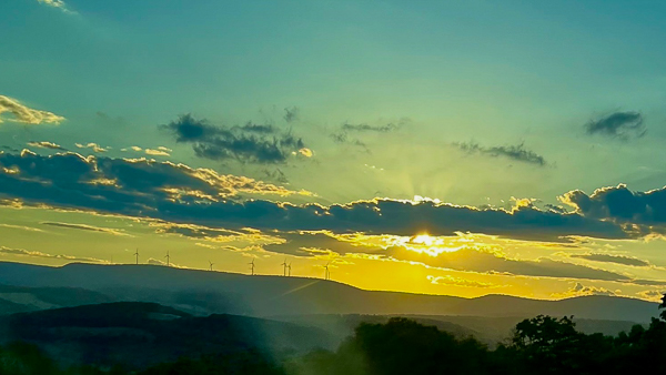 wind turbines at sunset