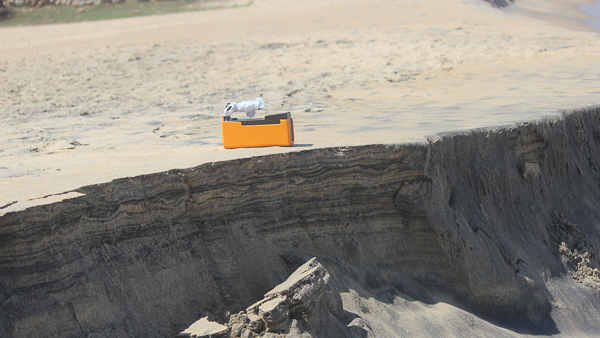 Geiger counter sitting on beach