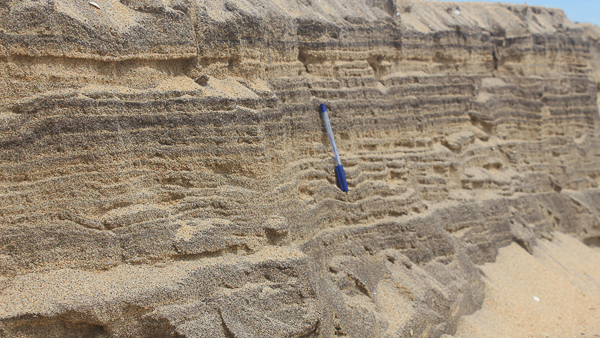 sand layered with seasonal deposition 