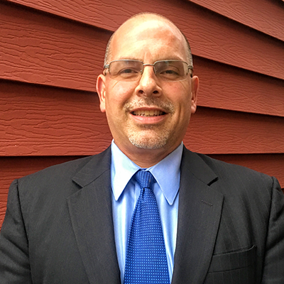 Mark R. Moore outside smiling
