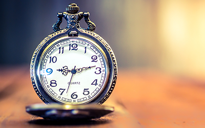 close up of pocket watch on table