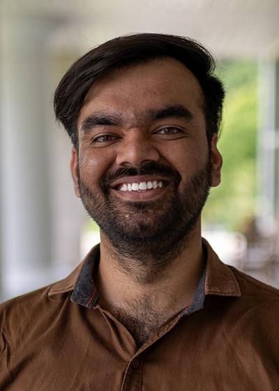 Nishant Mishra smiling outside.