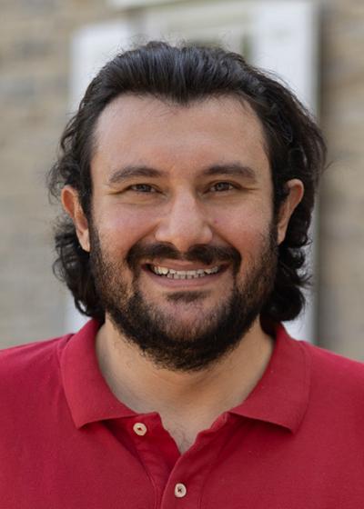 Oguz Berk Evcimen outside headshot.