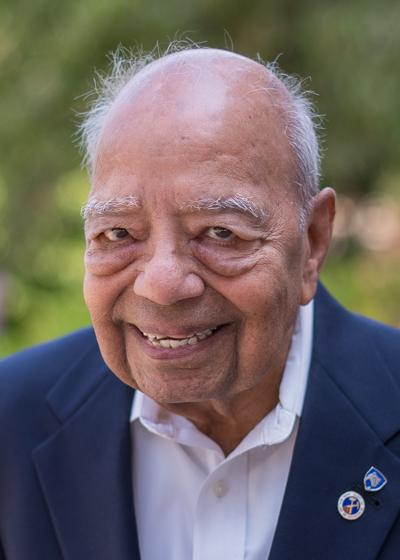 Raja Ramani outside smiling. 