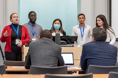 Student team presents in front of classroom