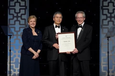 Song receives his award