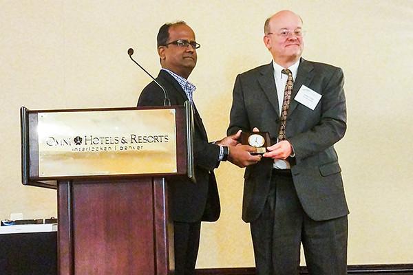 Kleit receiving award