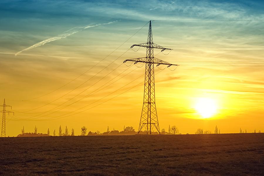 Silhouette of power line at sunset