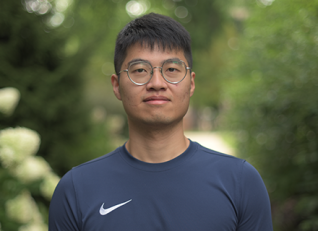 Qitao Zhang smiling outside